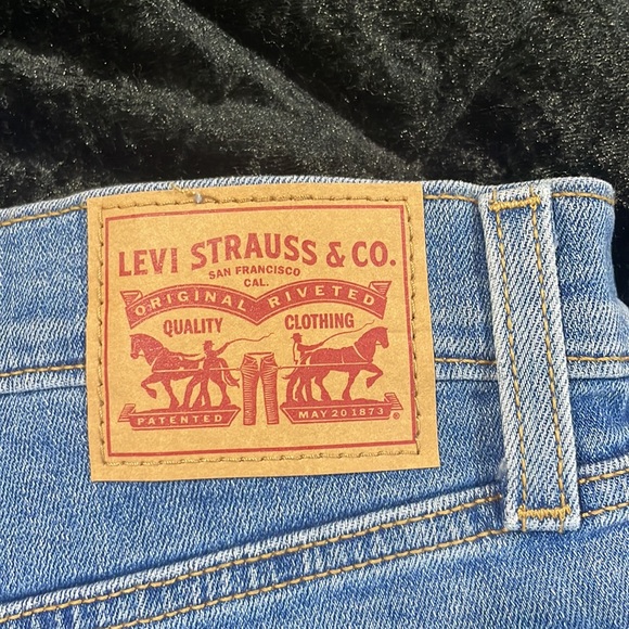 High Rise Blue Ripped Levi Shorts - Picture 4 of 5